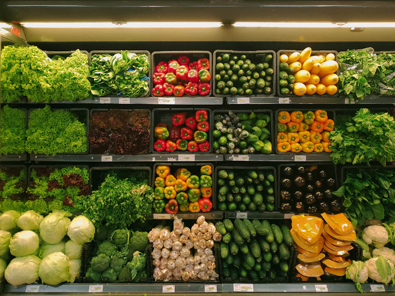 Supermarket shelves stocked with fresh produce
