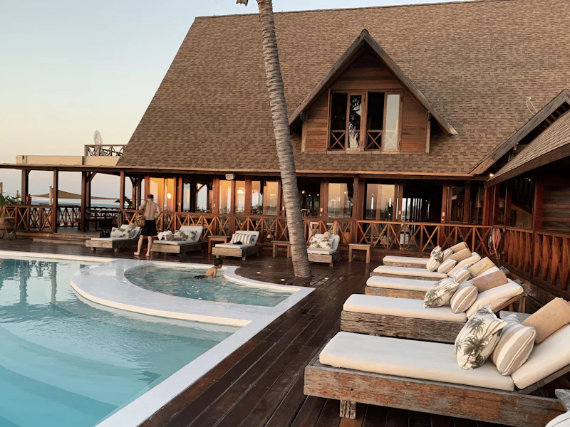 A resort pool deck at sunset