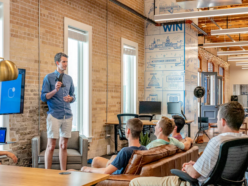 A strategist presenting campaign results to a client team